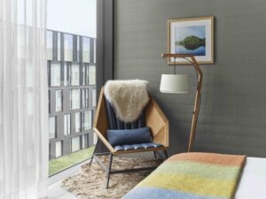 Armchair and floor lamp in a guest room