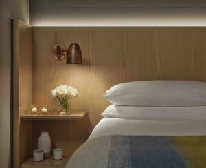 Bedside table with an adjustablereading lamp